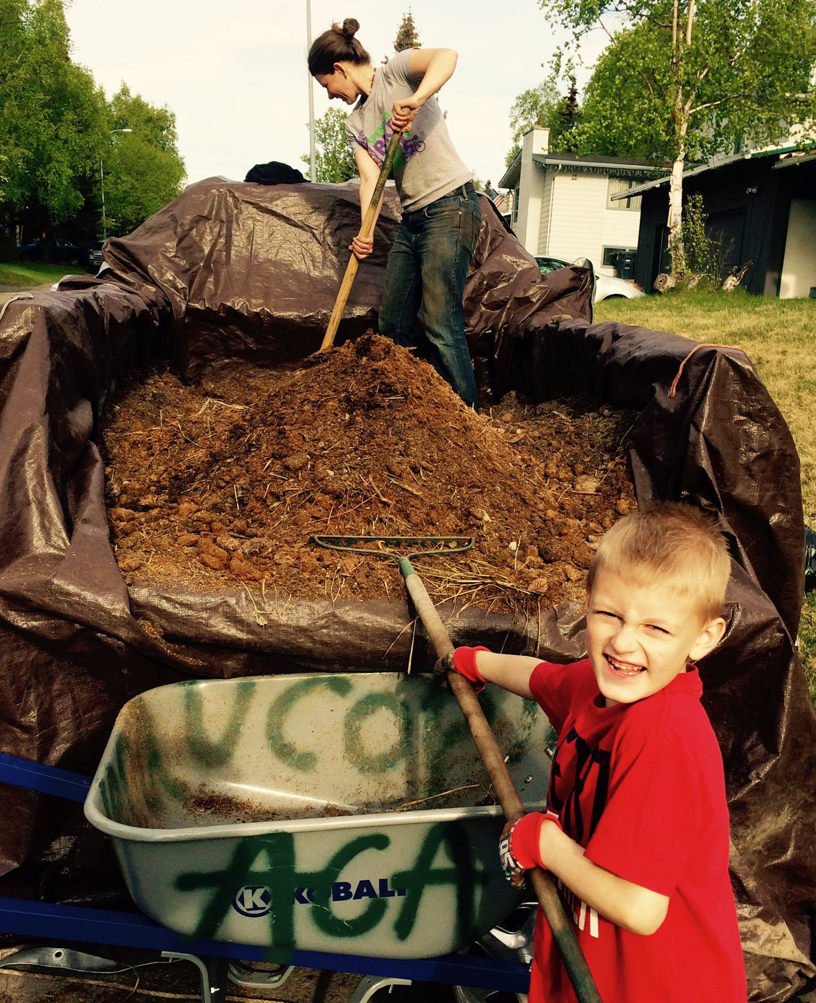 kid in garden compost